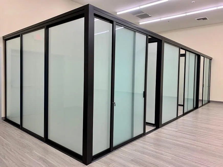 Office enclosure with frosted glass and black frames
